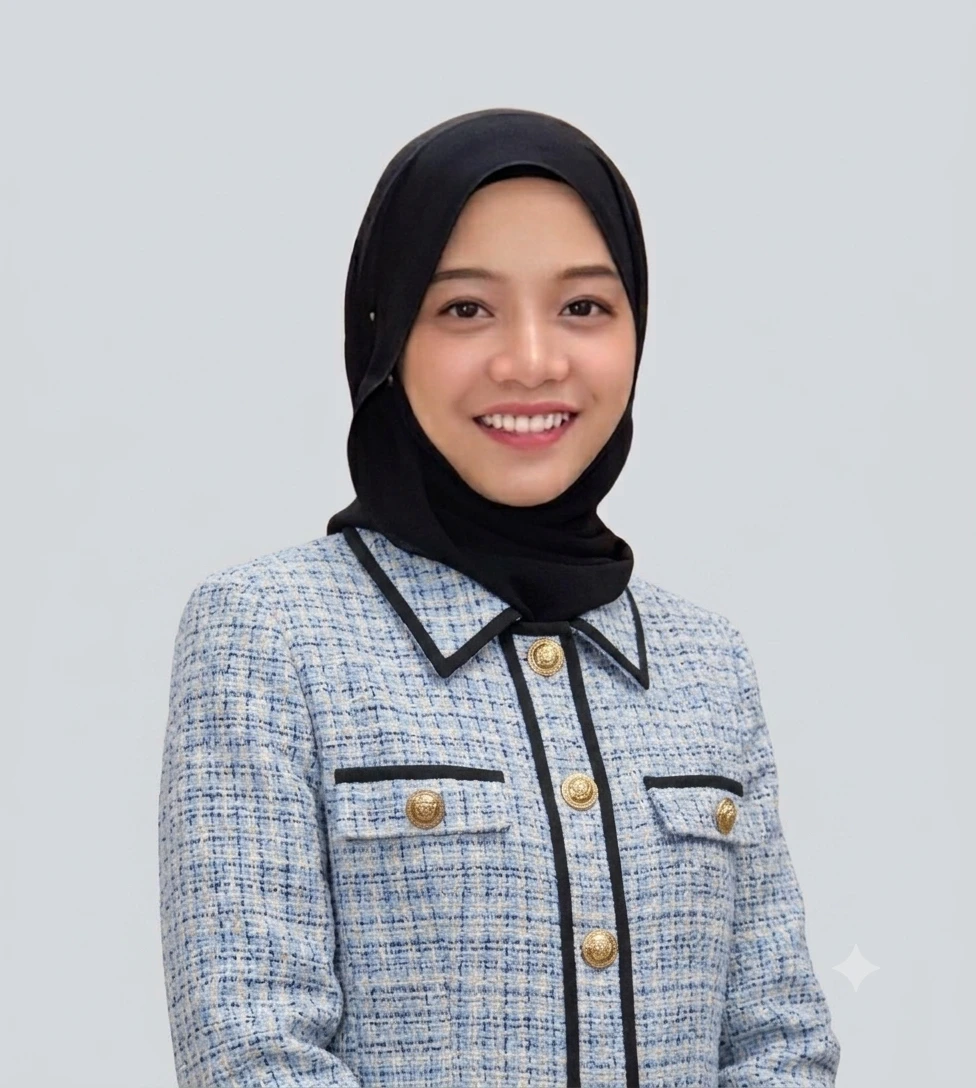 Zila in a black hijab and blue tweed jacket